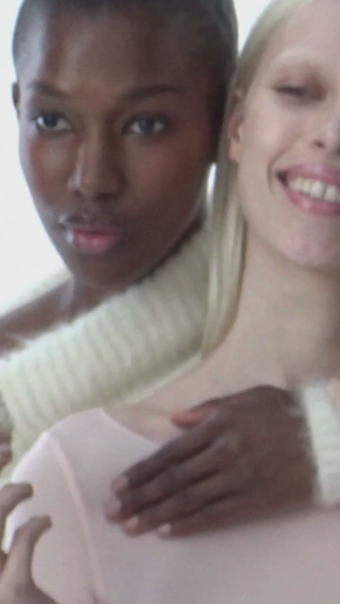 Models laughing with focus on lips.