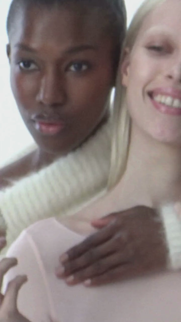 Models laughing with focus on lips.